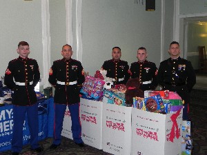 In December, Marines from Marine Corps Air Station Miramar display the collection of toy donations from chapter members.